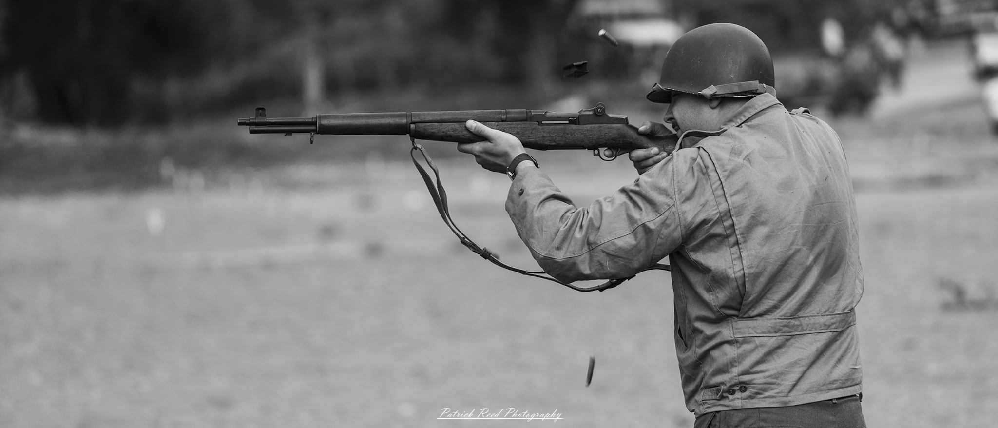 A dynamic image of a soldier firing an M1 Garand, the rifle's iconic semi-automatic action captured in mid-shot. The soldier is focused and steady, with the powerful weapon discharging a round, emphasizing the intensity of the moment.